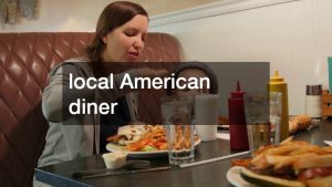 mom and kid eating at a local diner